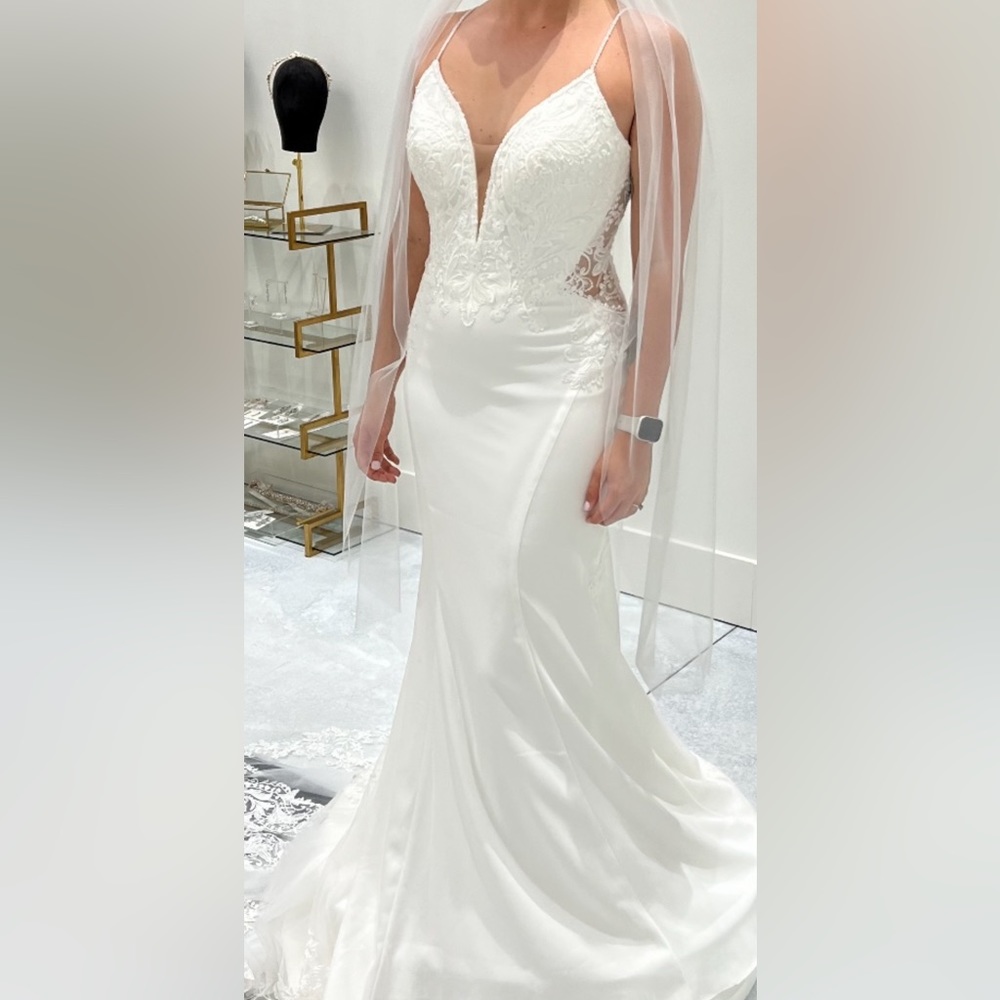 Never worn, still has tags, comes with the vail as well. No alterations